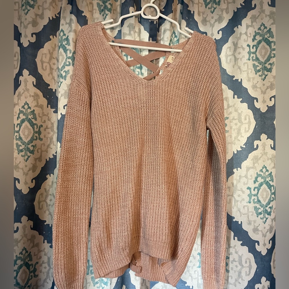 Pink sweater with braid detail in back